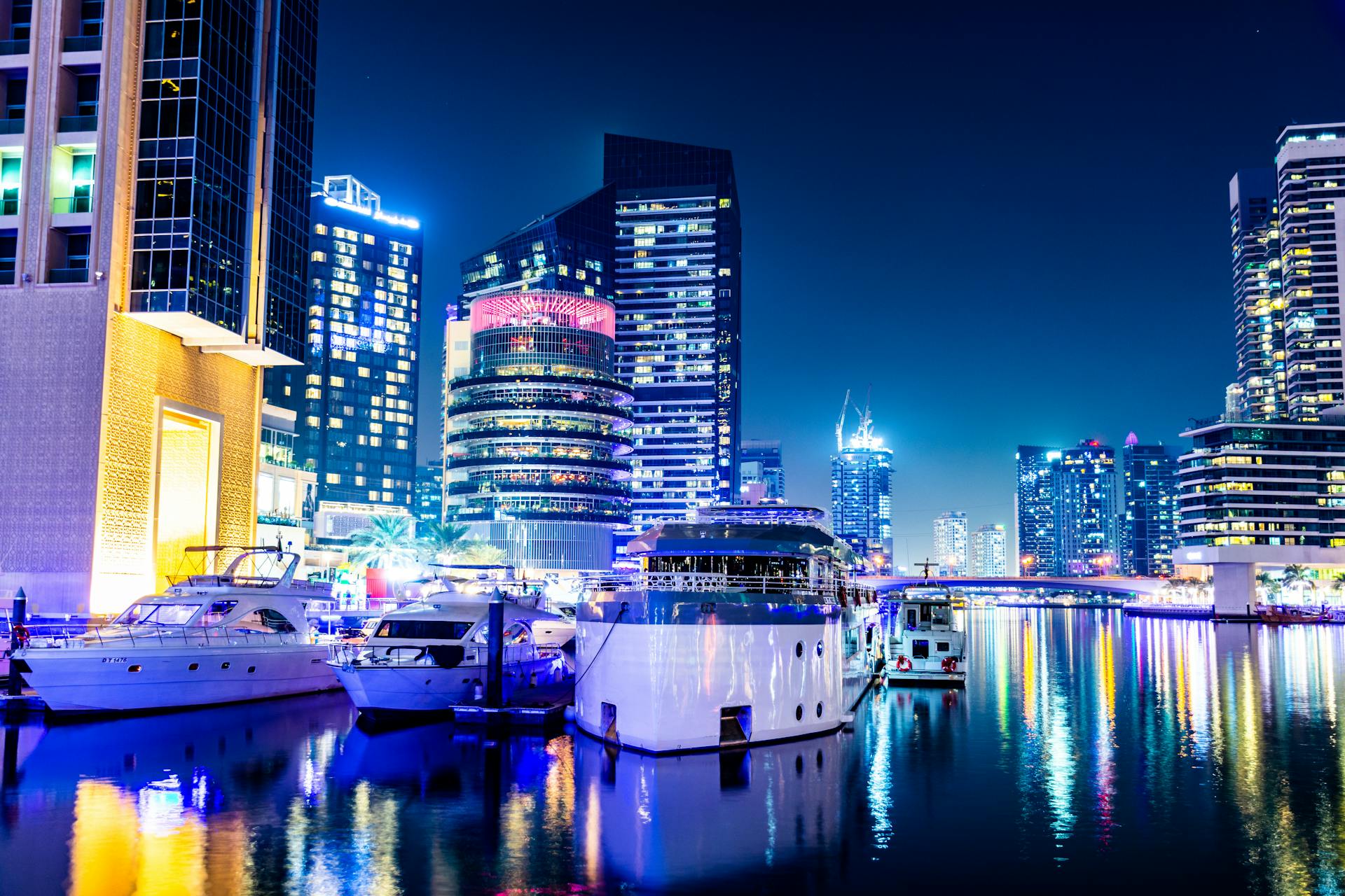Porto Arabia marina at sunset with yachts and Doha skyline